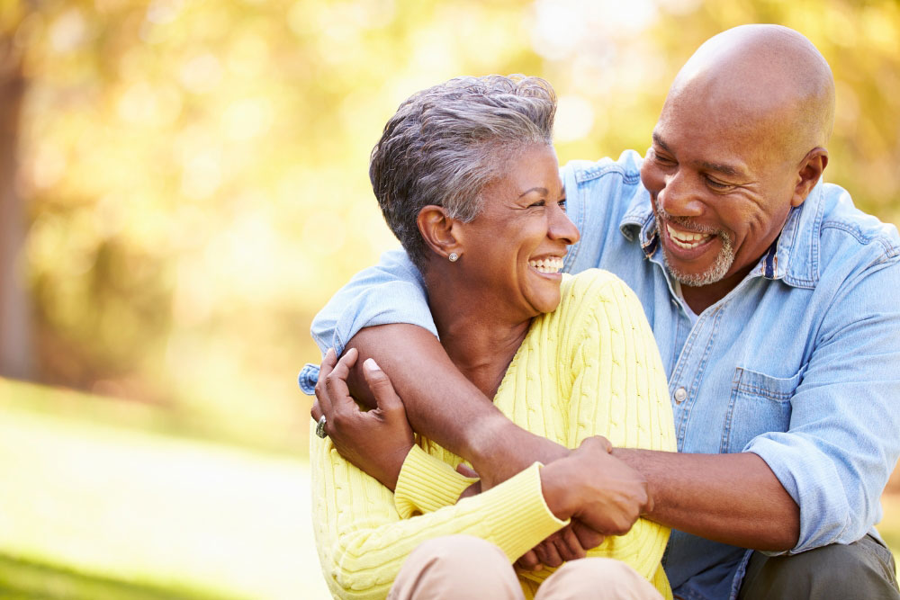 Happy senior couple enjoying financial freedom after resolving debt with help from a bankruptcy lawyer in Indiana.