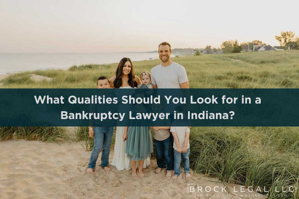 Family posing on a beach with a lawyer from Brock Legal in the background, discussing bankruptcy law in Indiana.