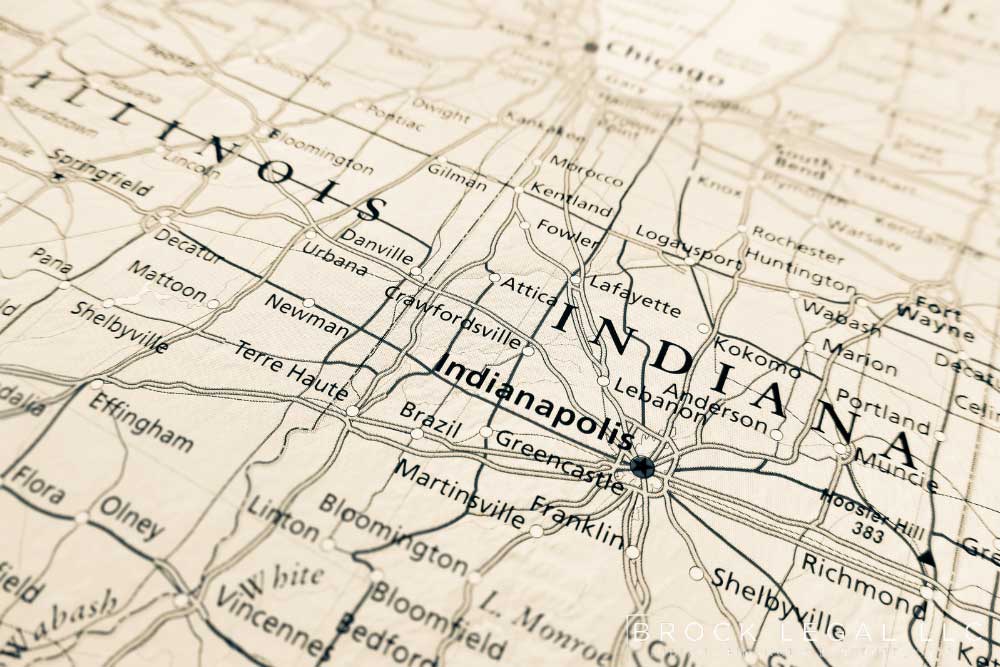 Close-up of an old map of Indiana, showing major cities like Indianapolis and Fort Wayne, with Brock Legal branding.